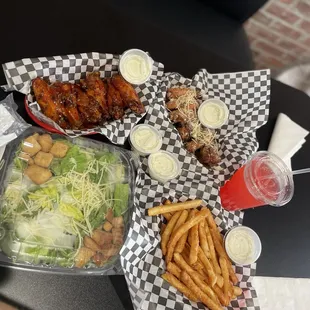 12 Piece Wings split 6 Asian Zing 6 Garlic Parm Seasoned Fries Caesar Salad Red Drink