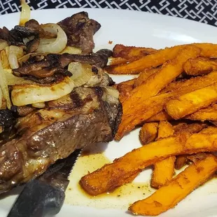 1 pound USDA Prime Boneless Ribeye from the butcher shop. Sweet Potato Fries as a side.