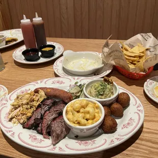 Well fed platter. Brisket, sausage, and in the left bbq chicken.