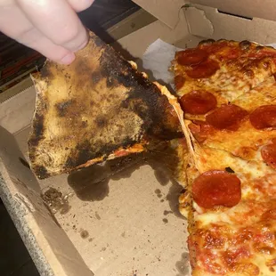 Burnt and greasy 12&apos;&apos; pepperoni pizza