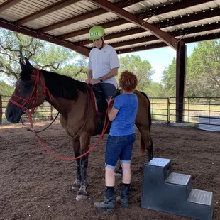 My boyfriend just after mounting the horse during his lesson with Genevieve and Sumo.