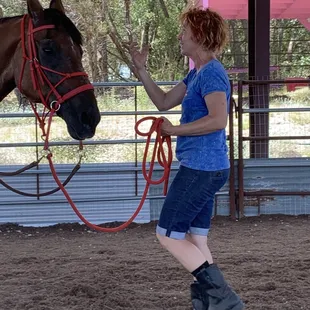 Genevieve, the instructor, guiding my boyfriend through his very first horsemanship lesson!