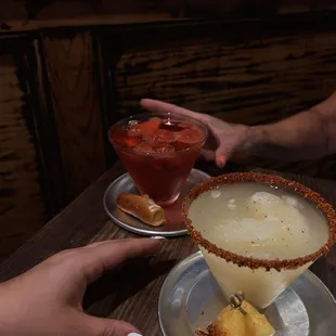 John&apos;s cherry water ice martini with Philly pretzel + pineapple water ice mock with Tajin rim + fresh pineapple garnish. Insane!