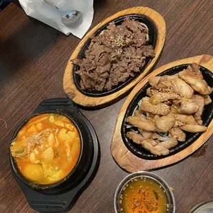 a variety of dishes of food on a table
