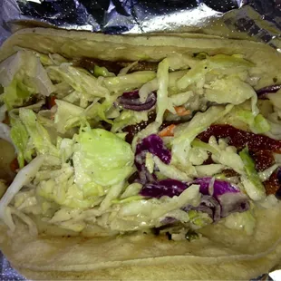 Yummy!  Fish taco w/ bacon and slaw!