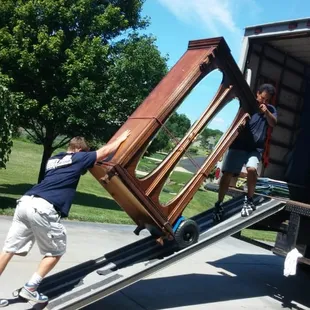 Tom &amp; Brett move a large armoire.
