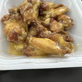 a closeup of the wings in a styrofoam container