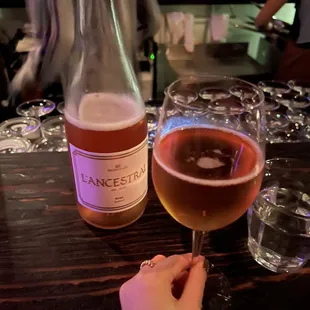 a person holding a glass of wine
