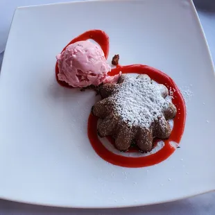 a dessert with ice cream and strawberry ice cream