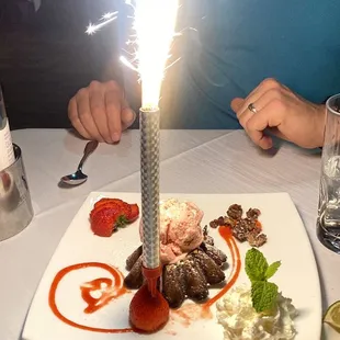 a plate of food with a sparkler