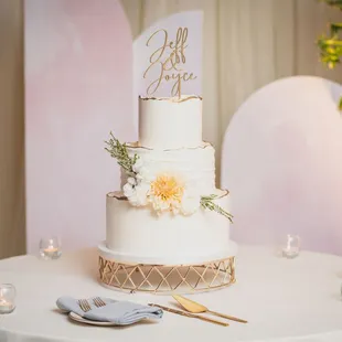 a white wedding cake with flowers