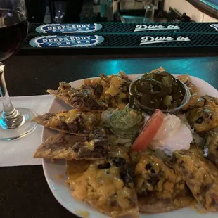 steak fajita Nachos  and a glass of  Cabernet Sauvignon