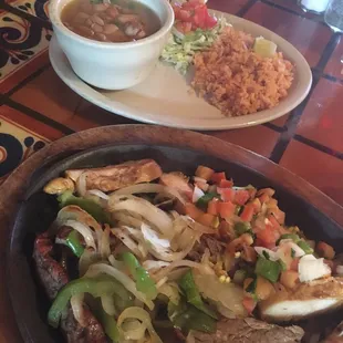 Beef &amp; chicken fajita combo, with charro beans &amp; rice. Fajitas are marinated, then mesquite grilled.