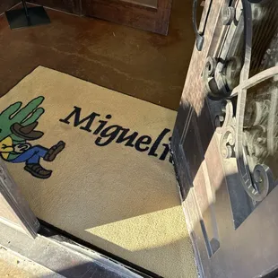 a doormat with a cactus on it