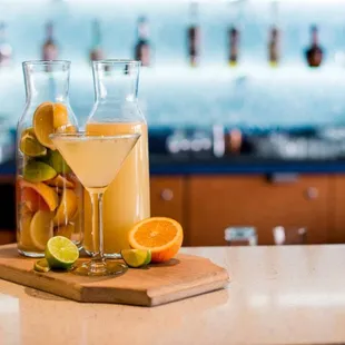 two cocktails on a bar