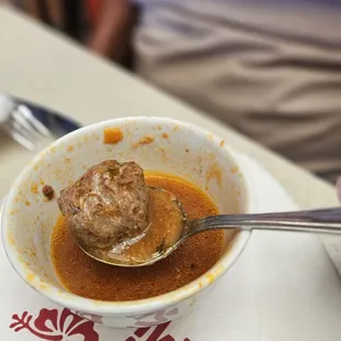 One out of 3 meatballs in the albondiags soup