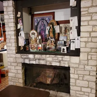 a brick fireplace with a mantle