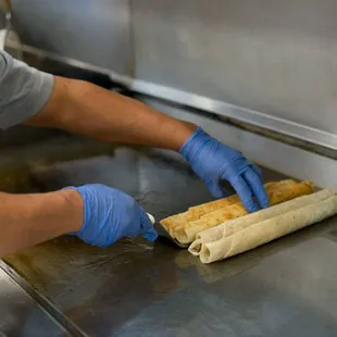 a man preparing food in a kitchen