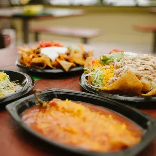 three plates of mexican food