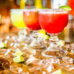 two margaritas with lime wedges