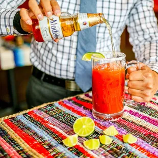 a man pouring a drink