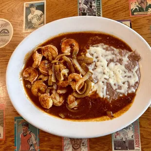 Camarones a la Diabla - shrimps in a chipotle sauce. Served with rice and beans and tortilla.