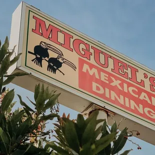 a sign for miguel's mexican dining