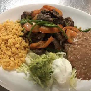 Bistek A La Mexicana. Sautéed with Onion, tomato, and onions.