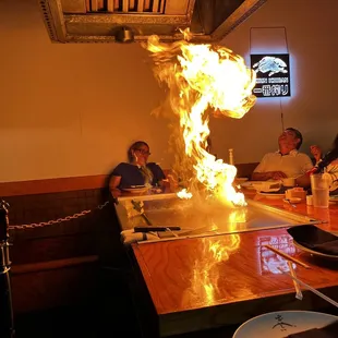 a fire coming out of the grill