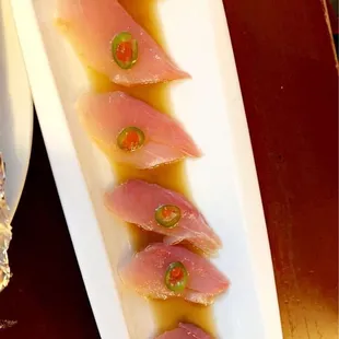 a plate of tuna with a side of rice