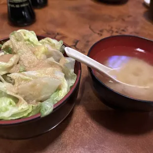 a bowl of salad and a bowl of soup