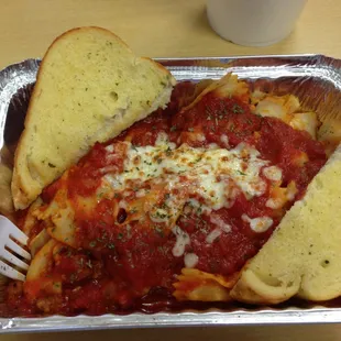 Bow tie pasta with meat sauce and garlic bread