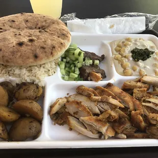 Grilled Chicken, rice, potatoes, hummus and a pita and a delicious cup of lemonade