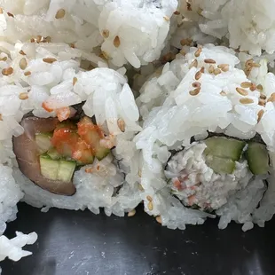 Spicy Salmon Roll and a California Roll