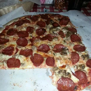 Thin crust sausage, pepperoni,  mushrooms on half
