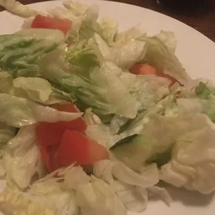 Sad dinner salad with only chunks of iceberg lettuce a couple tomato pieces and one cucumber slice $3.75 skip it!