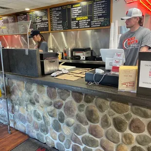 a man working behind the counter
