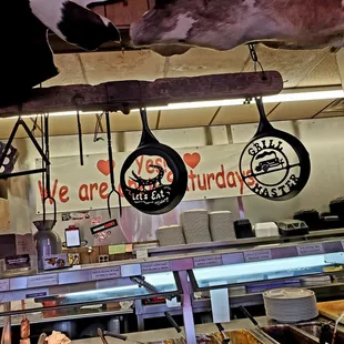 a cow hanging from the ceiling