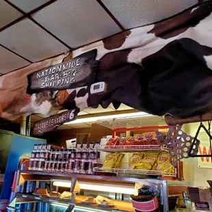 a cow hanging from the ceiling