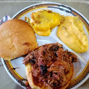 Pulled Pork Sandwich Plate with Garlic &amp; cheddar smashed taters and Cheezy corn bake with Paulino and onion