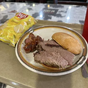 Sliced brisket sandwich with a jalapeño and cheddar cheese link It was alright, the bread was a bit tough though.
