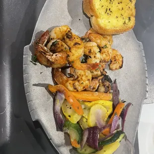 Fresh Gulf Shrimp grilled with mixed vegetables and toast.