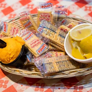 a basket of crackers and a lemon