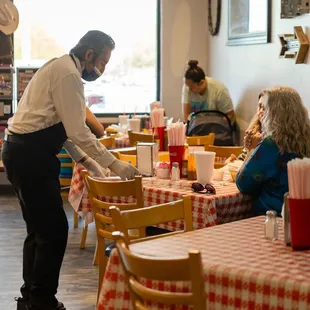 a waitress serving customers