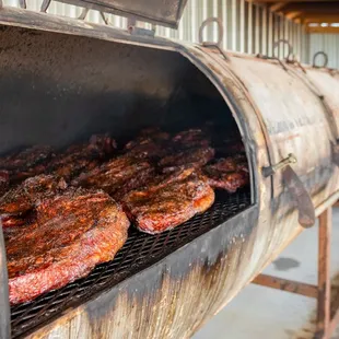 ribs cooking on a grill