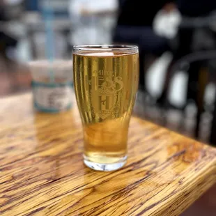 a glass of beer on a table