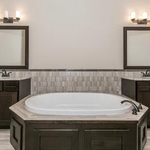a bathroom with a large jacuzzi tub