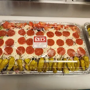 wo trays of pizza
