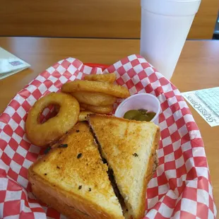 a sandwich and onion rings