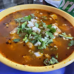 Menudo with onions, cilantro, jalapeño peppers and limes